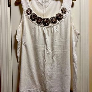 Sleeveless white top with embellished neckline